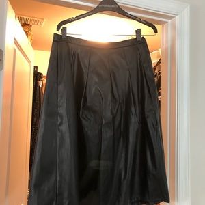 Black leather like pleated knee length skirt